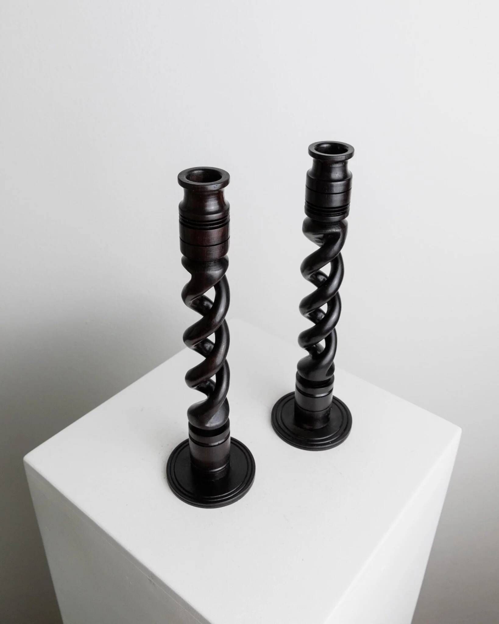 Set of 2 vintage dark wood candlesticks, twisted design, Italy, 1970s.