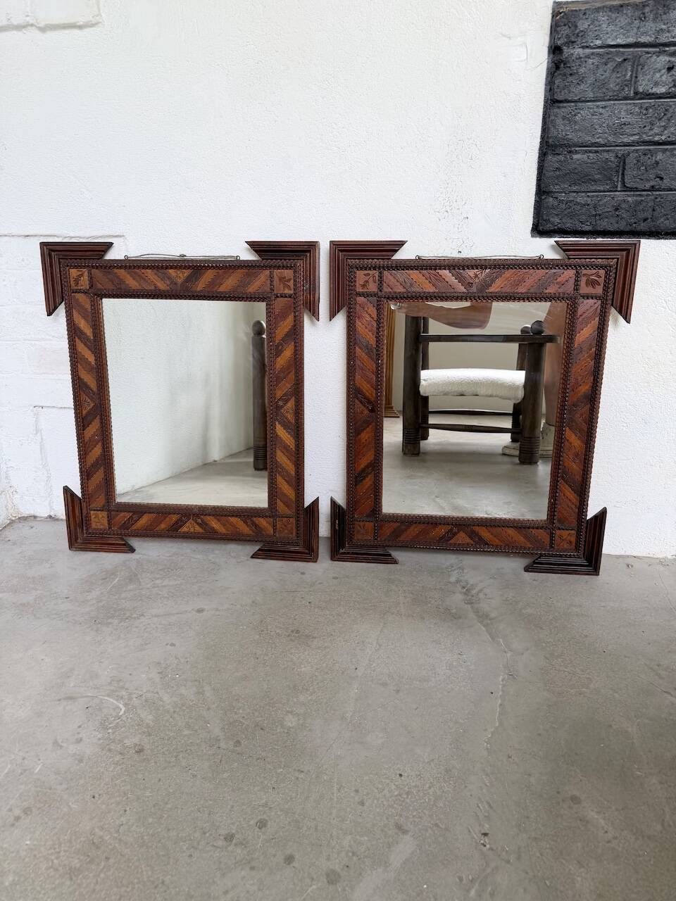 Pair of wooden mirrors in tramp art style
