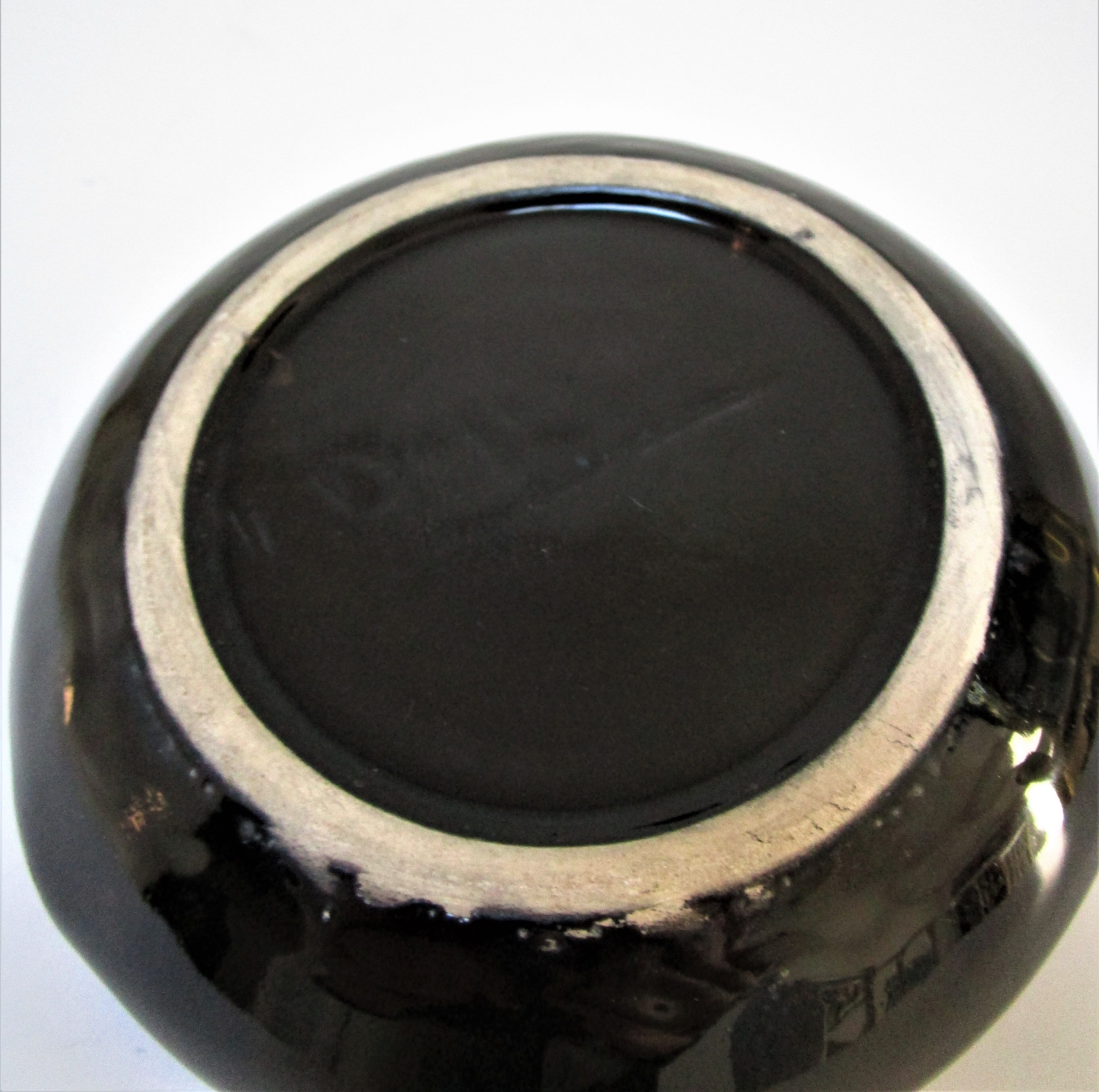 Black ceramic ashtray and vintage gold 50/60