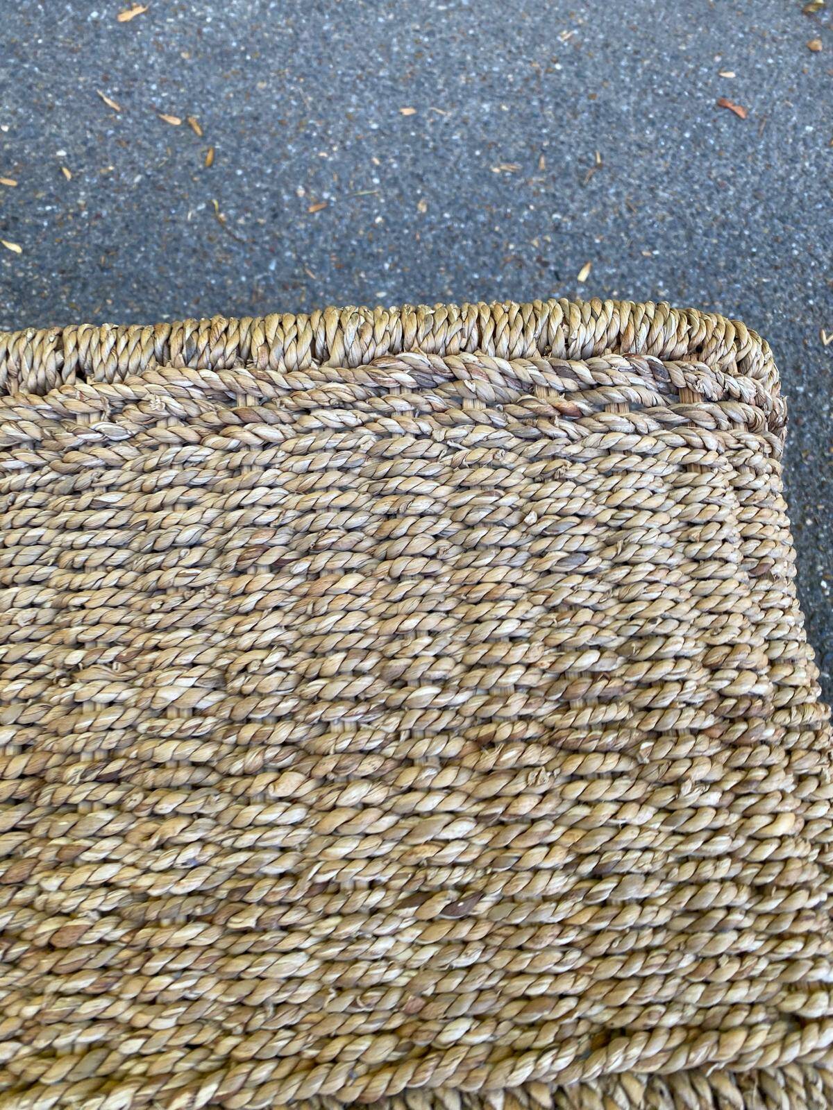 Large basket / rectangular storage bin made of woven natural fibre.