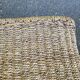 Large basket / rectangular storage bin made of woven natural fibre.