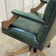English chesterfield office armchair in green leather from the 1980s
