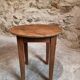 Antique round side table with oak legs and a pine top, circa 1900.