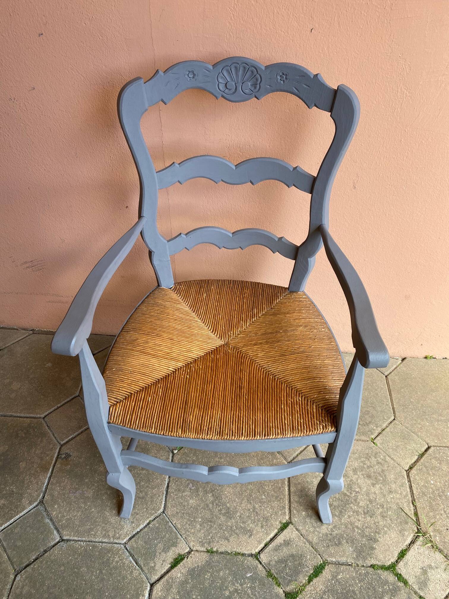 Provencal style straw armchair with gray blue patina armrests
