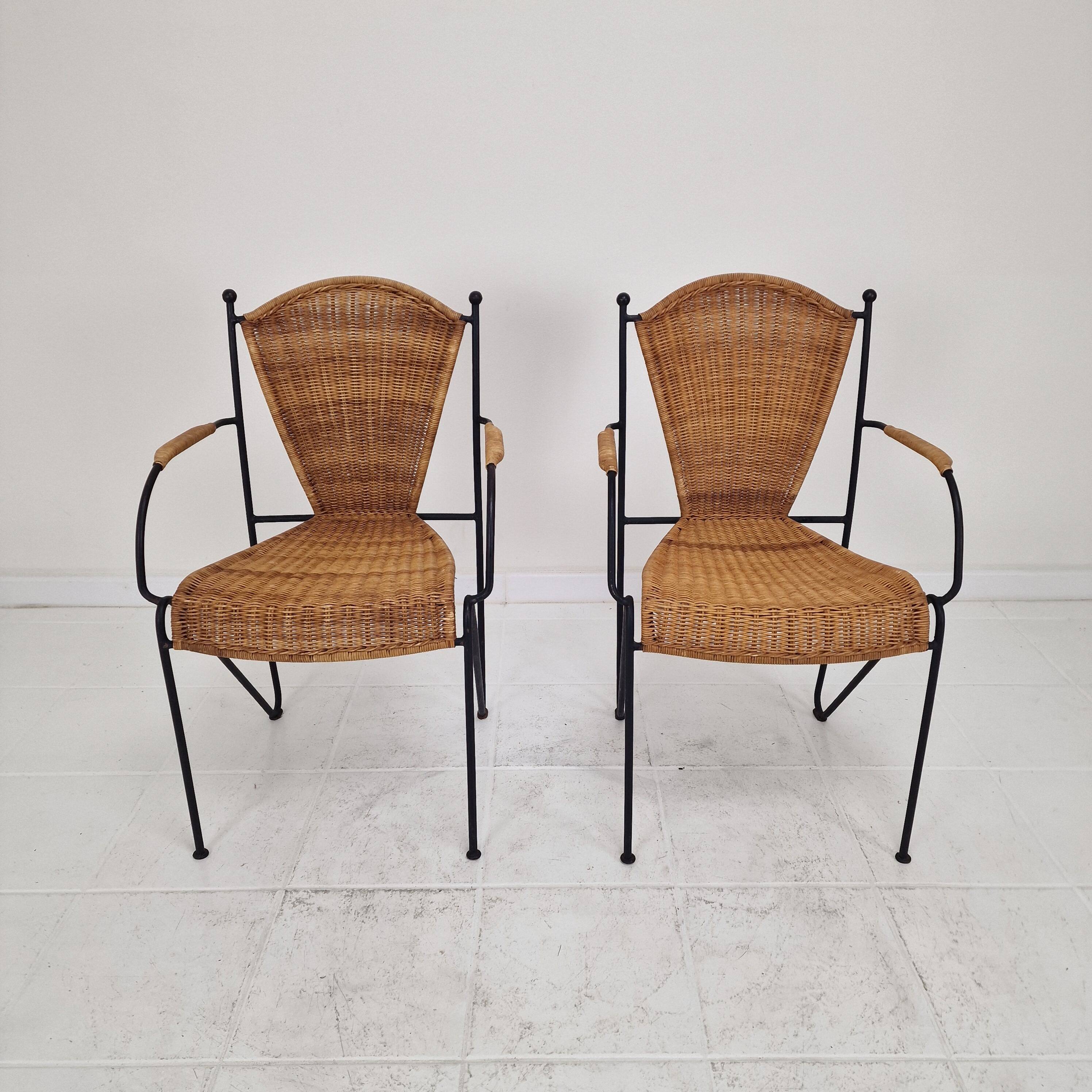 Pair of wicker and iron armchairs by Frederic Weinberg, United States, 1950s.