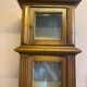 Walnut showcase, grooved uprights, 4 glass shelves