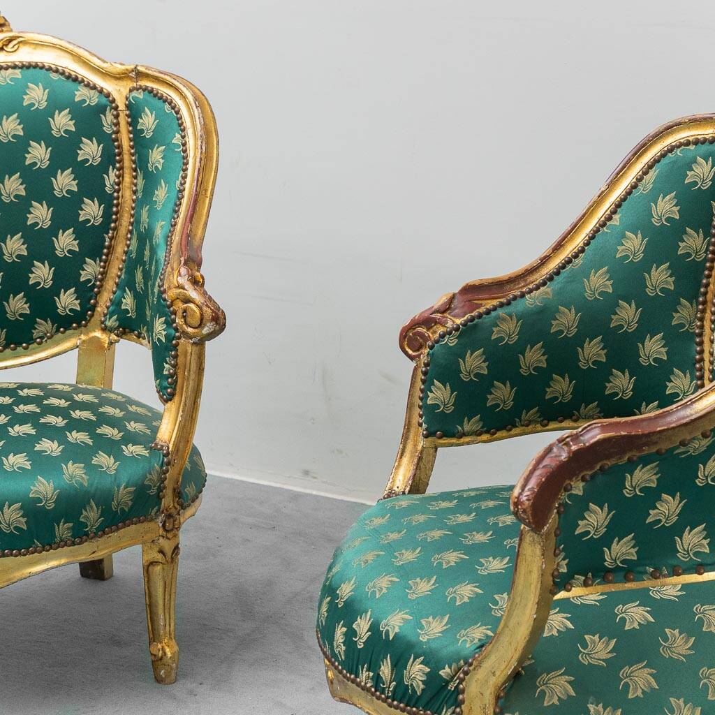 Pair of Louis XV style gilded armchairs with vintage green fabric