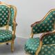 Pair of Louis XV style gilded armchairs with vintage green fabric