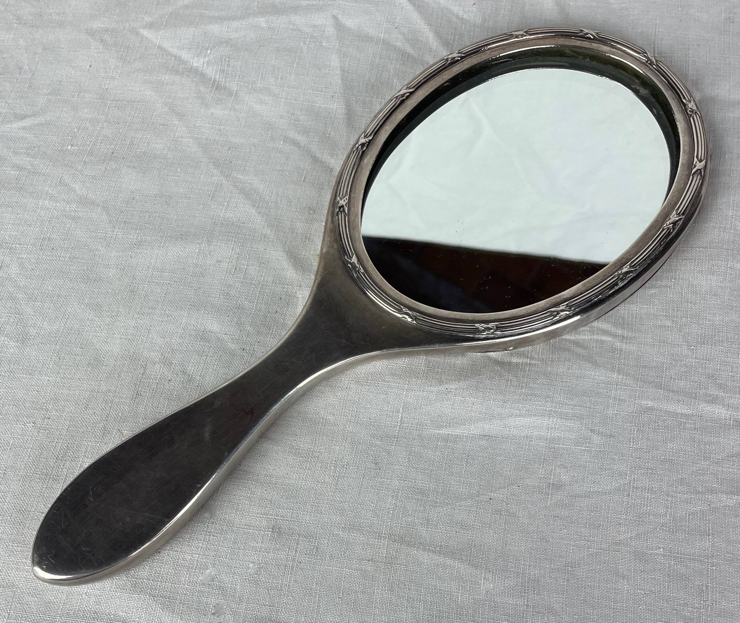 Silver metal hand mirror