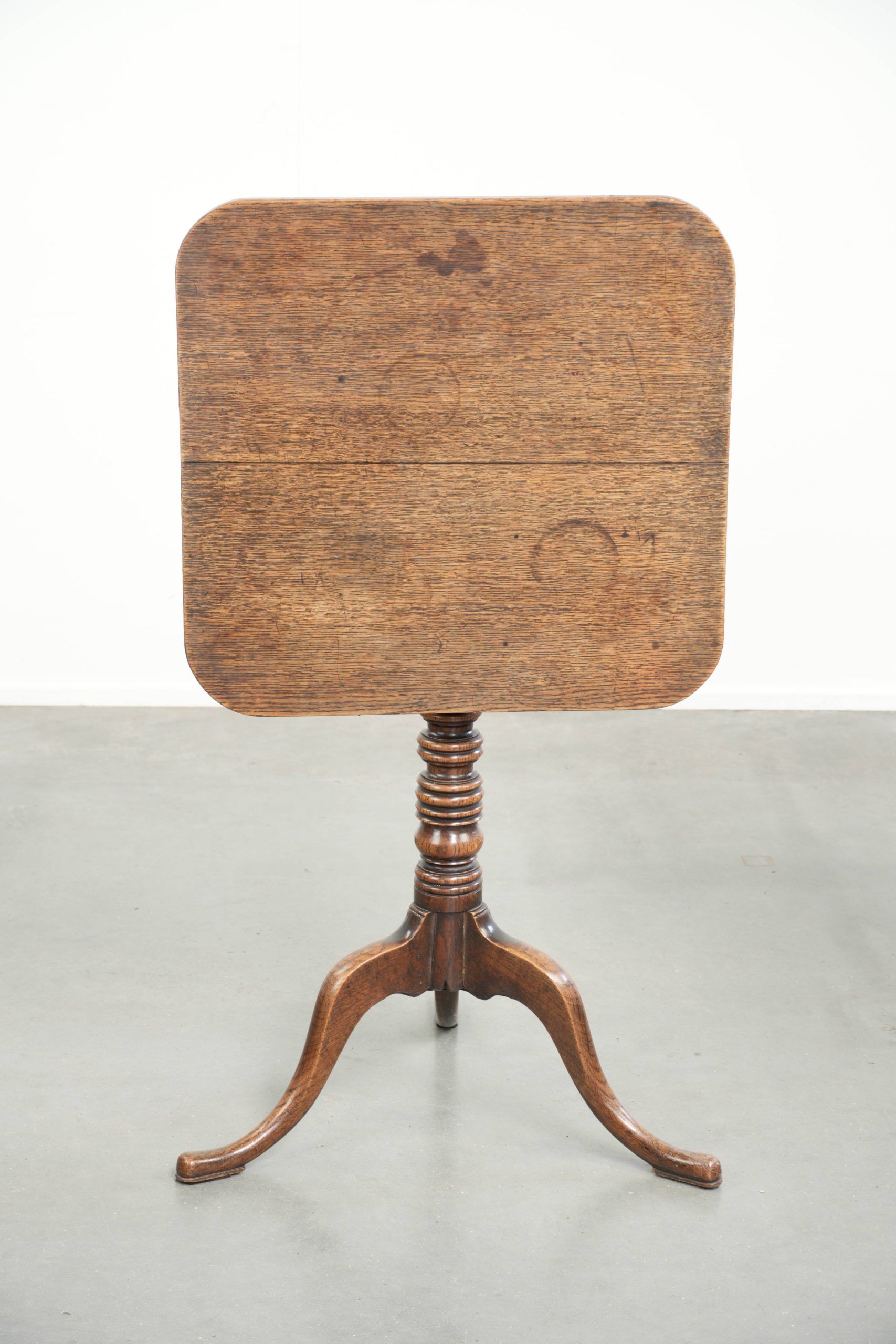 Antique English oak tilt top table from the 19th century in a unique shape