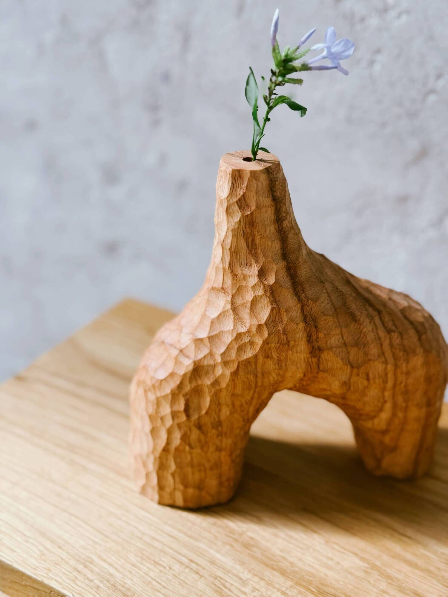 Hand-carved soliflore vase in solid chestnut wood.