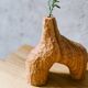 Hand-carved soliflore vase in solid chestnut wood.