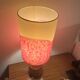 Vintage lamp with a carved wooden base from the 1970s.