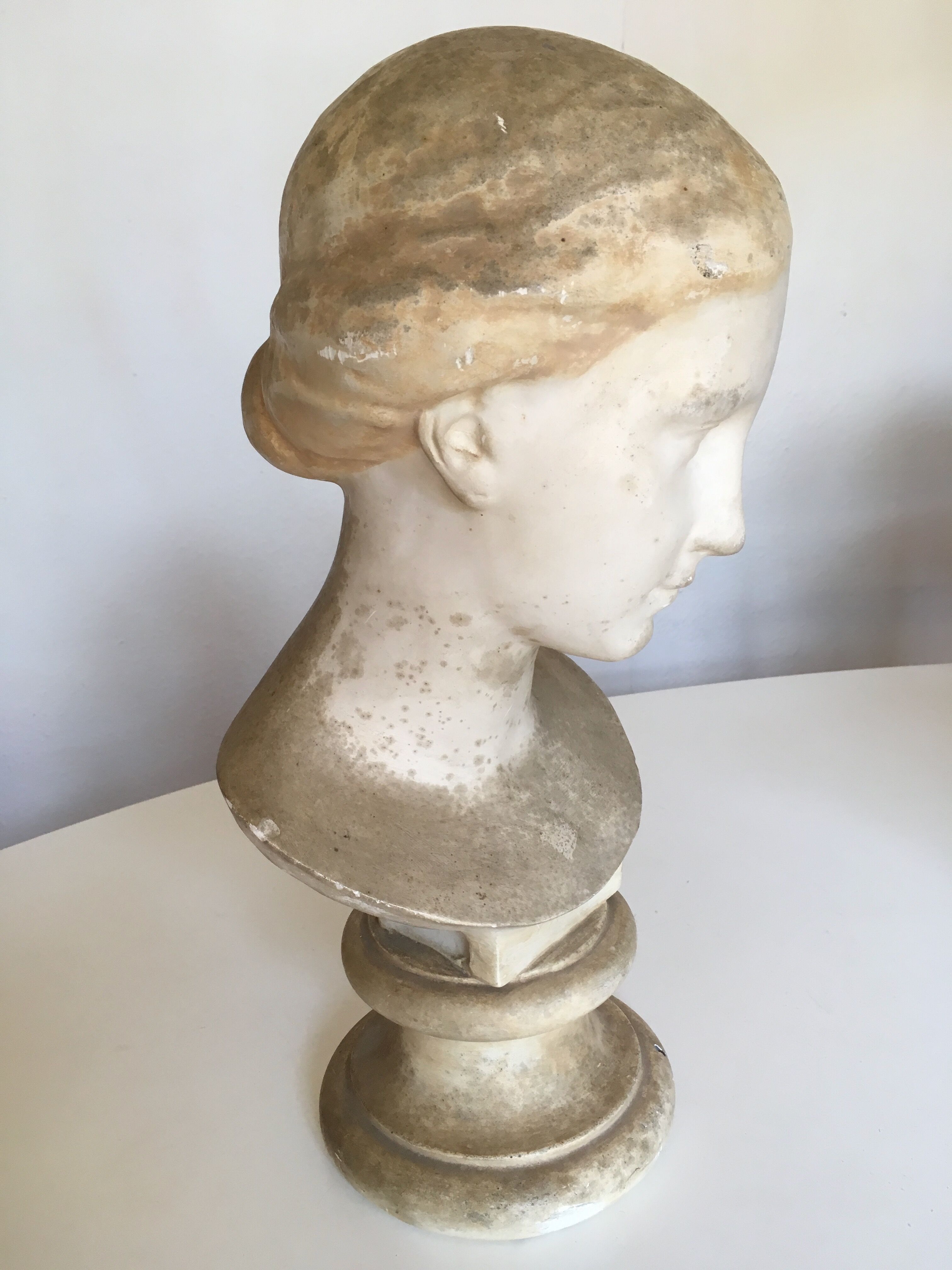 Former girl bust end 19th in plaster cast on its base
