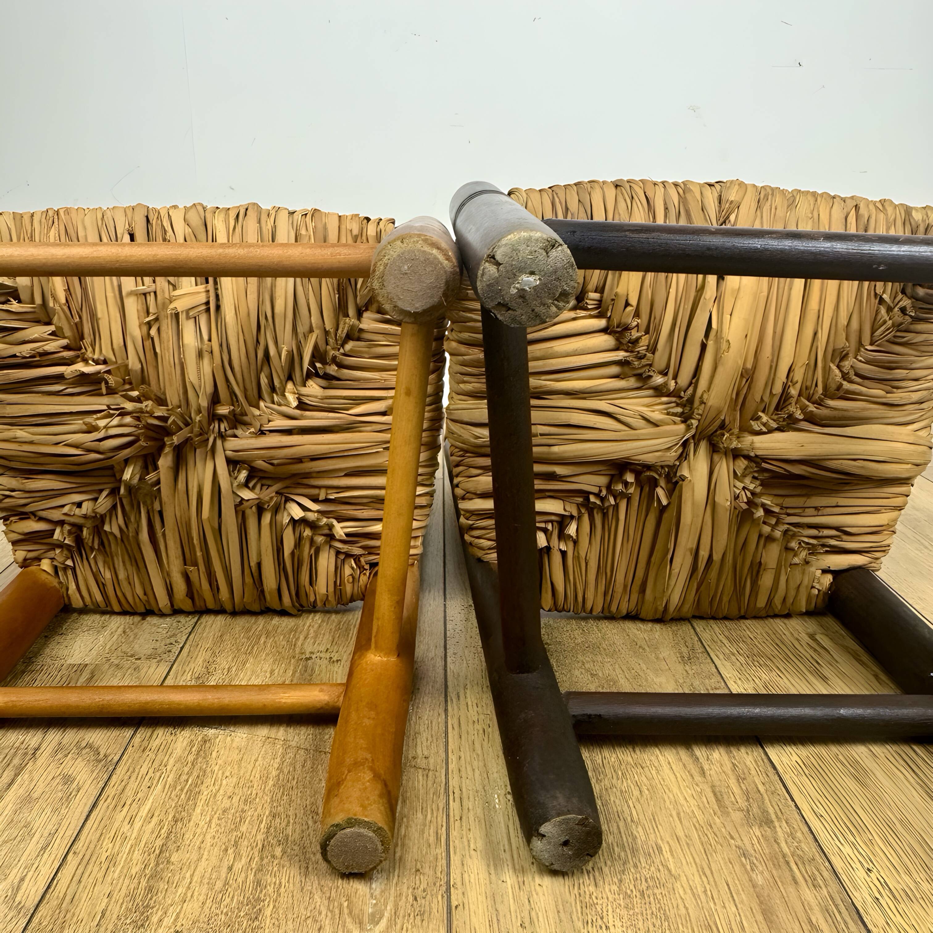 Pair of old wooden and straw children's chairs.