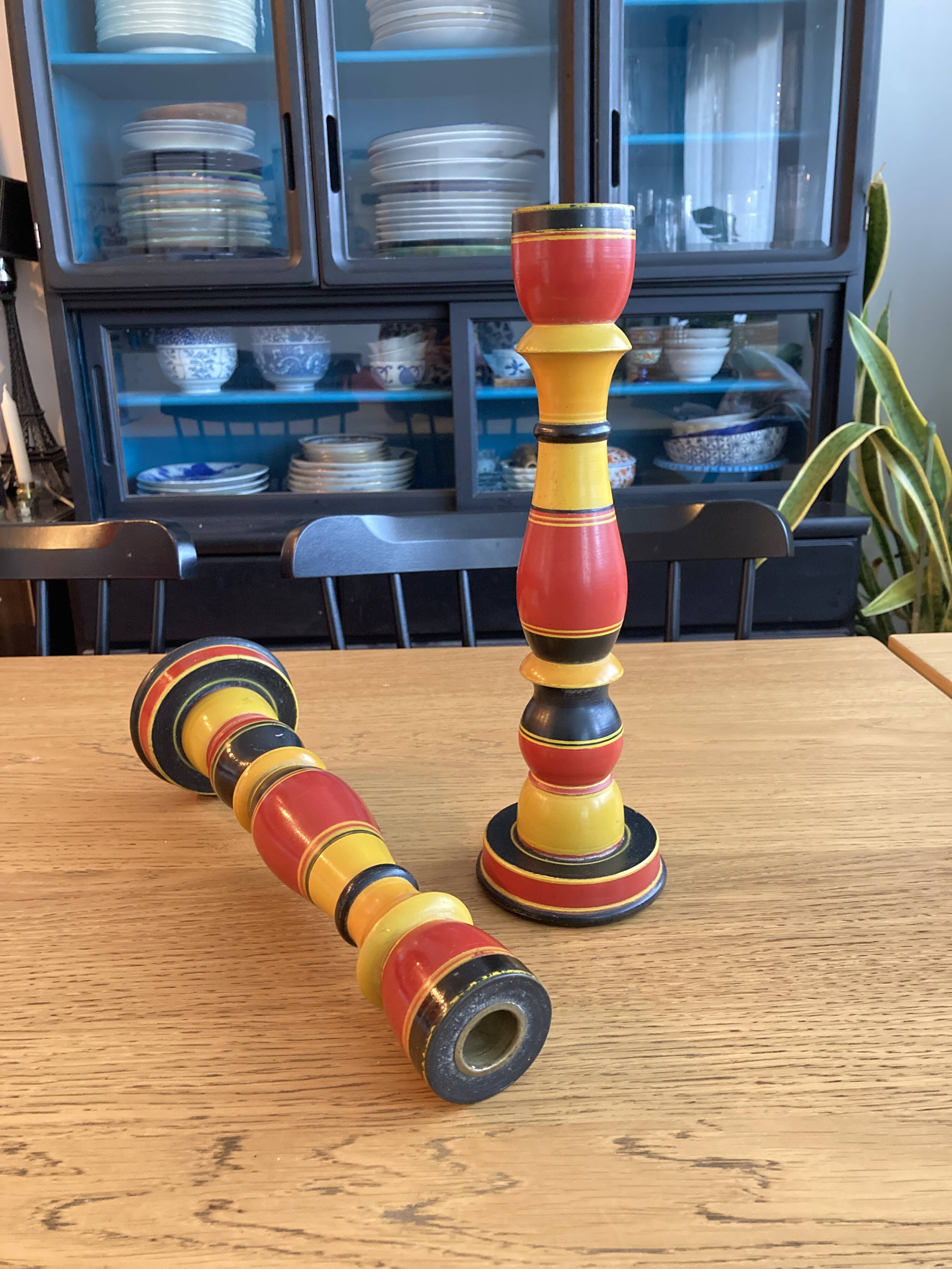 Polychrome turned wooden candlesticks