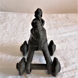 Old child's toy. Horse with bronze wheels. Ethnic object.