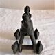 Old child's toy. Horse with bronze wheels. Ethnic object.
