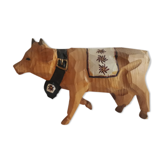 Carved and painted wooden cow