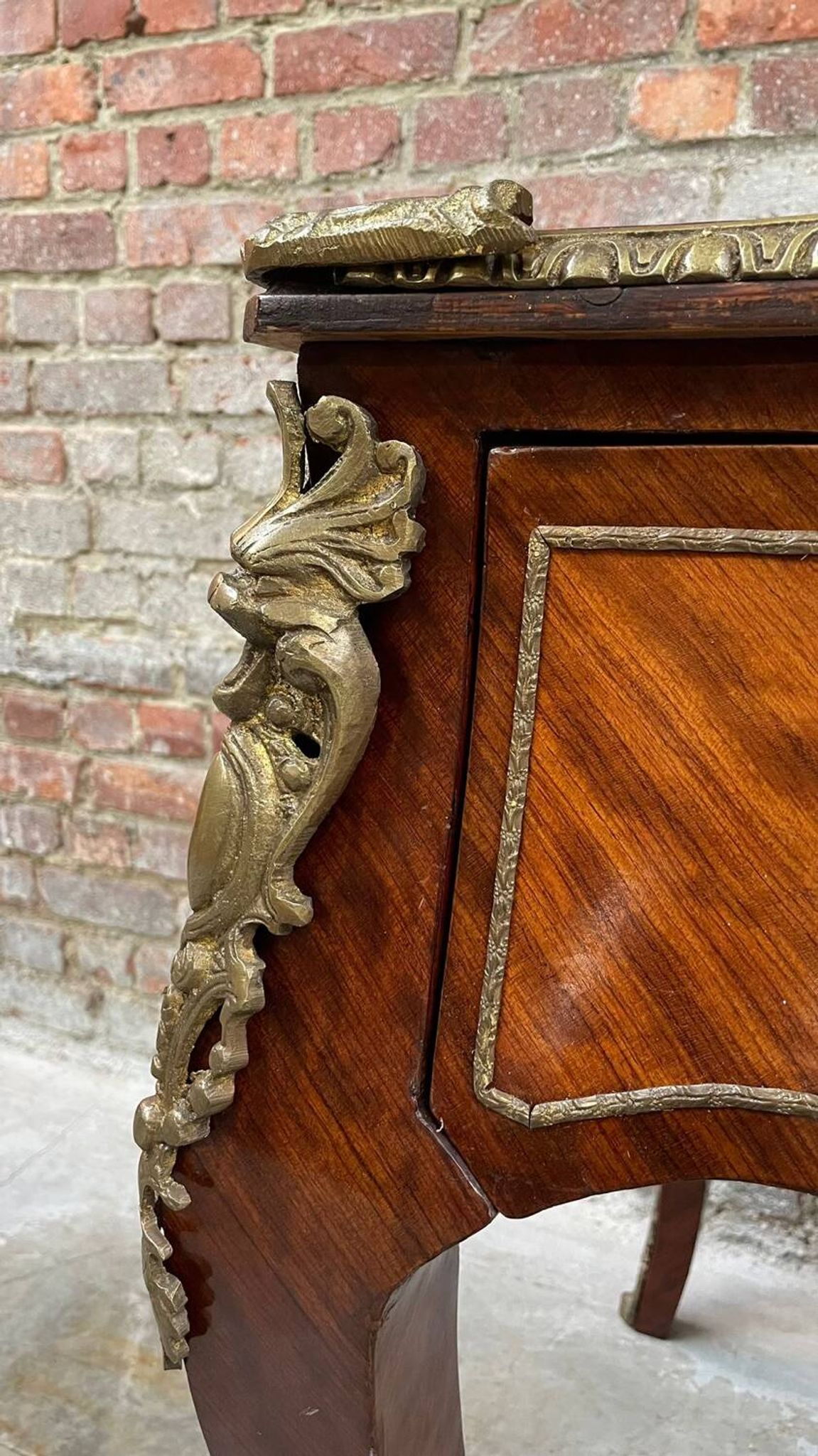Antique French-style desk with green leather top and bronze mounts