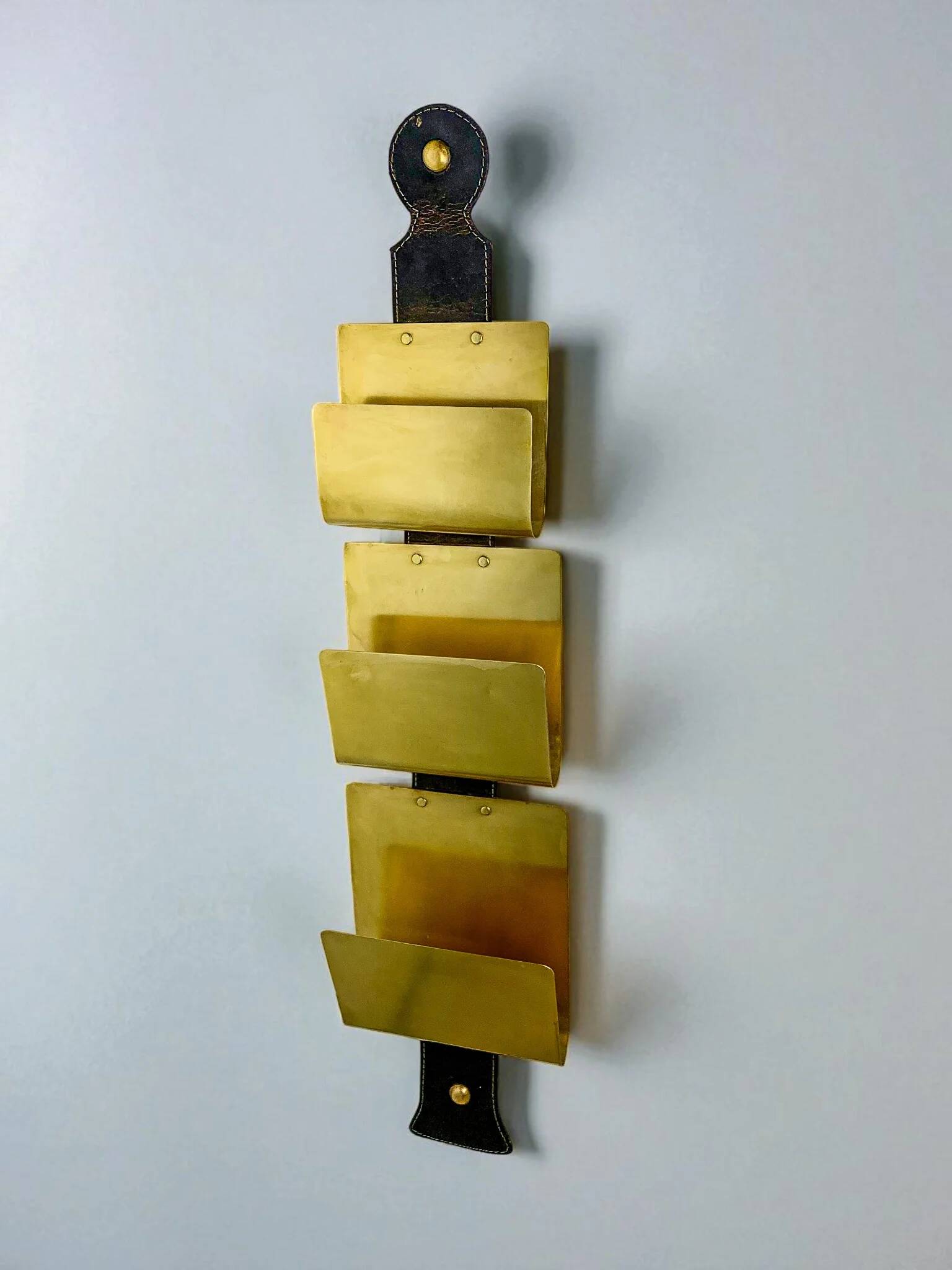 Valenti brass & leather wall-mounted magazine rack, Spain, 1970s