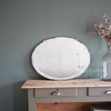 Antique oval bevelled mirror