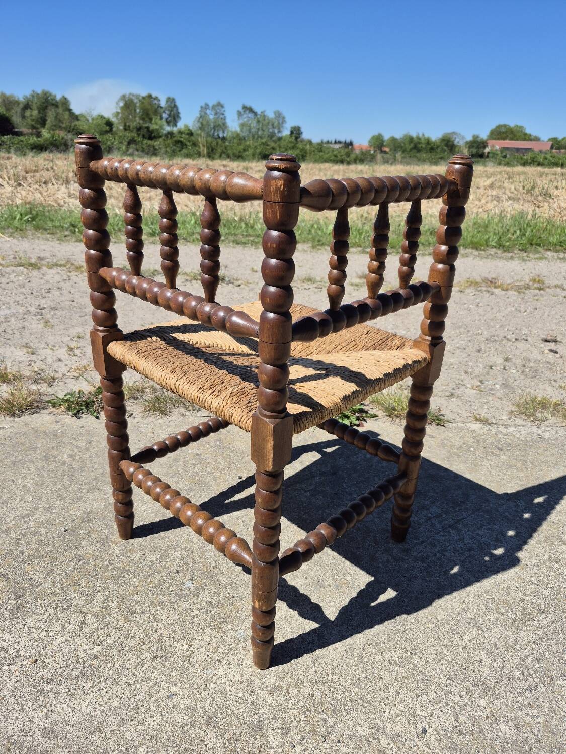 Vintage Dutch rustic corner chair bobbin turned oak with rush seating