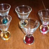 5 small glasses with colored bubble inclusions
