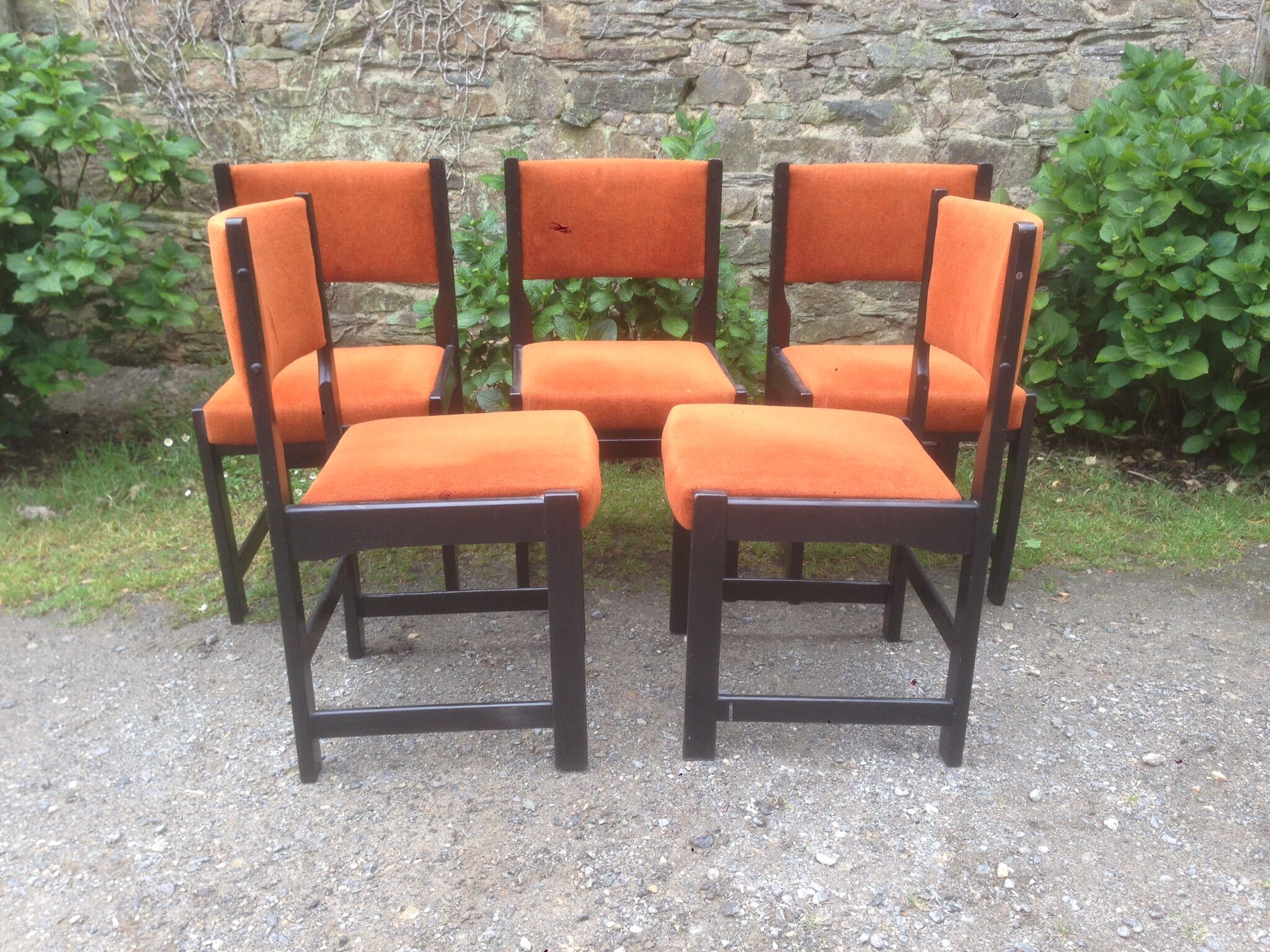 Series of 6 vintage chairs in orange fabric and black lace-up.