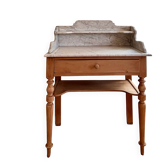 Antique wooden dresser with raw wood and marble.
