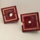 Pair of art deco candlesticks in bordeaux ceramics