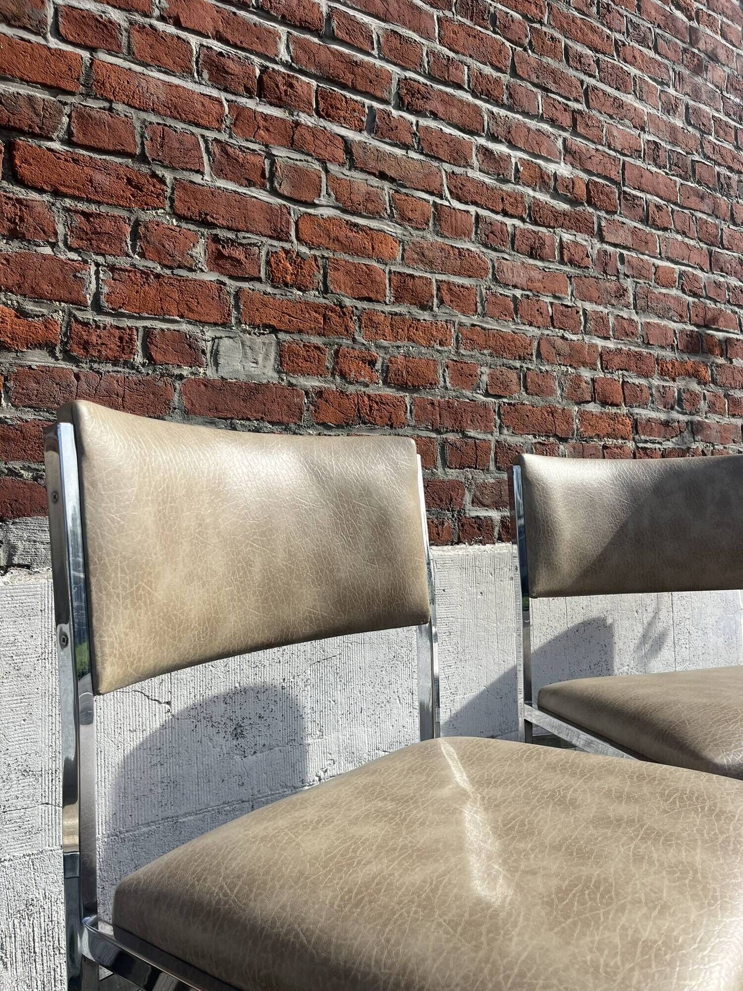 Set of 4 vintage chairs in chrome and faux leather.