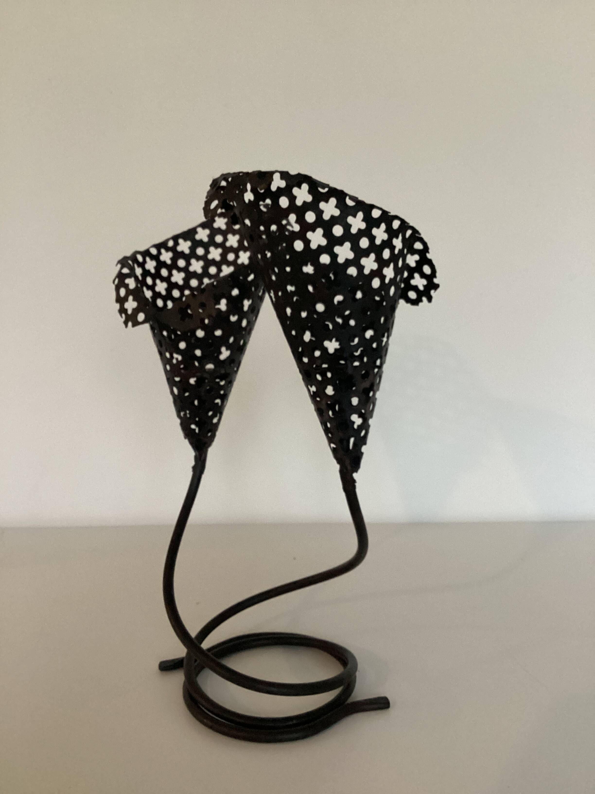 Perforated metal candle holder
