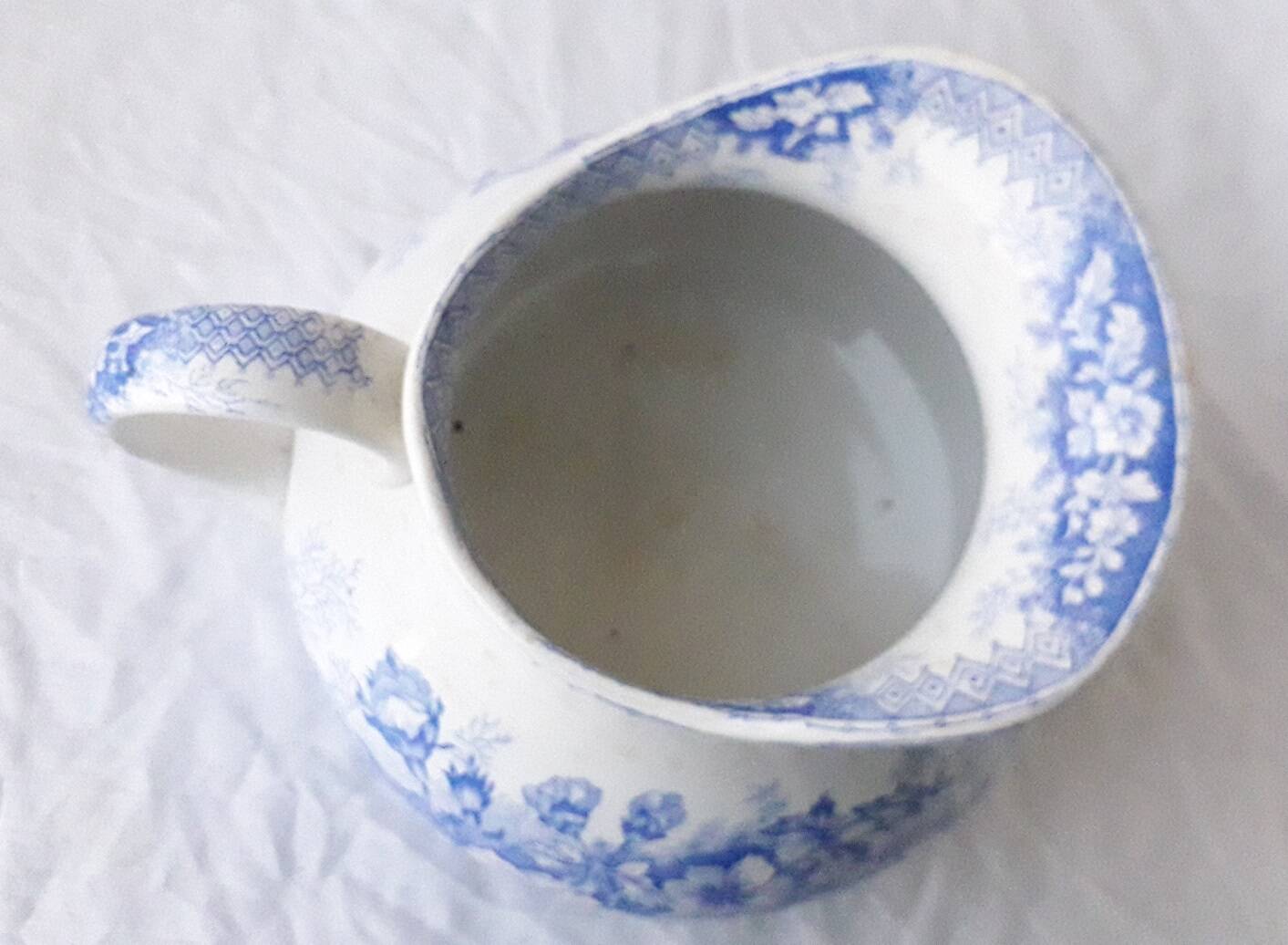 Pitcher jug in Saint Amand earthenware.
