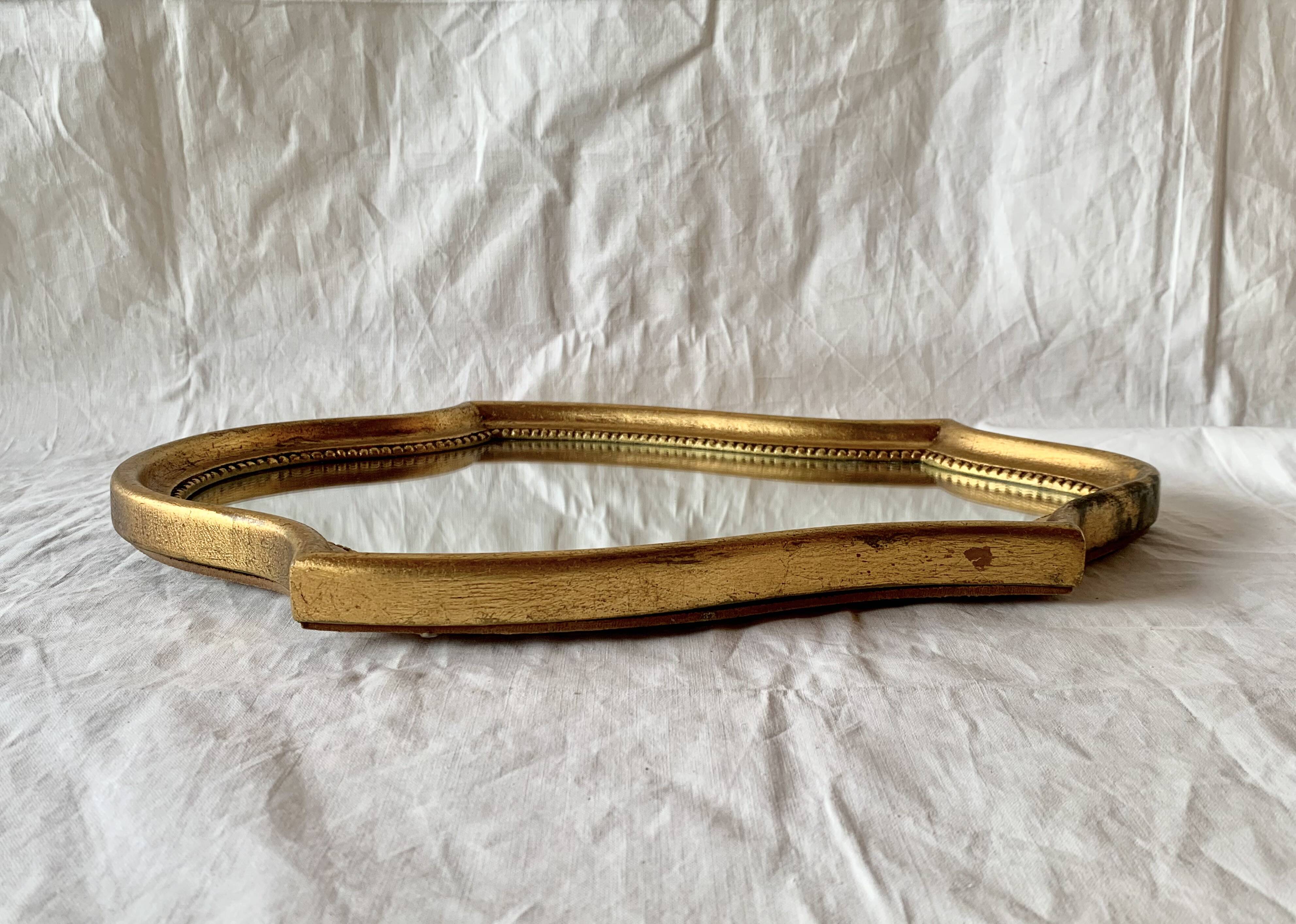 Vintage wall mirror in gilded wood