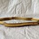 Miroir mural vintage en bois doré
