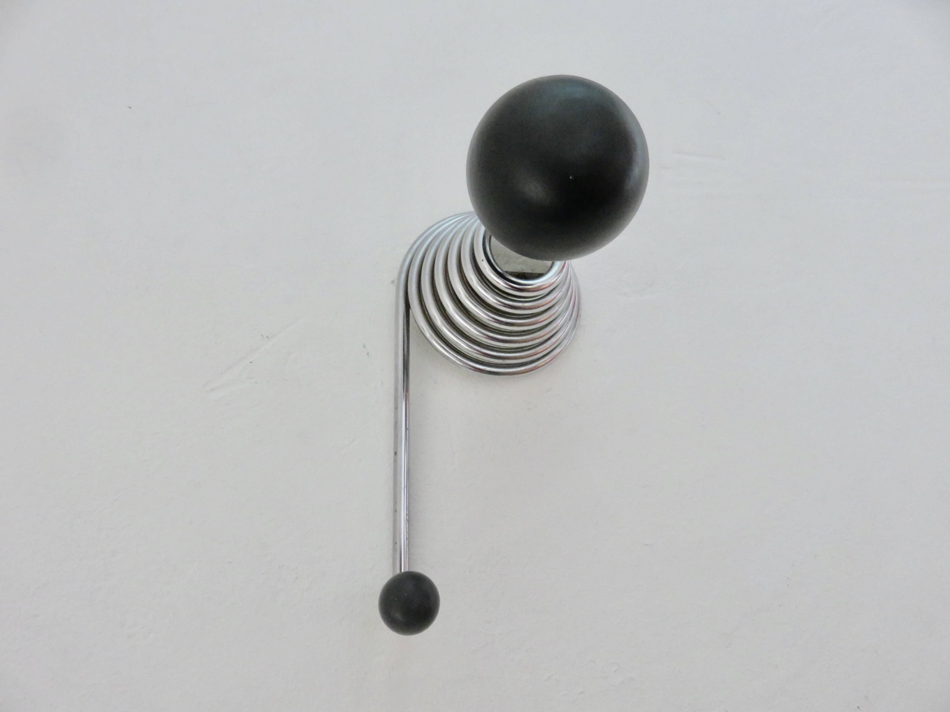 "Streamline" wall coat rack in chromed metal and black lacquered wood, 1970.