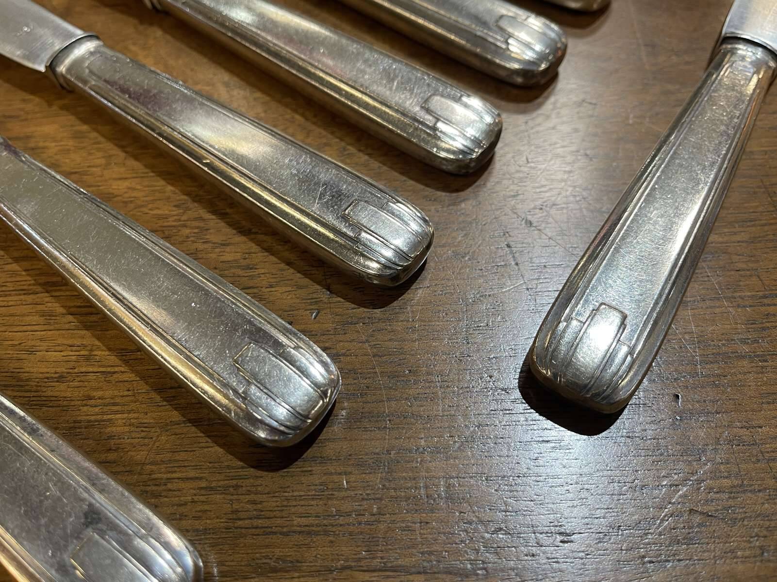Set of 11 French Art Deco silver plated knives