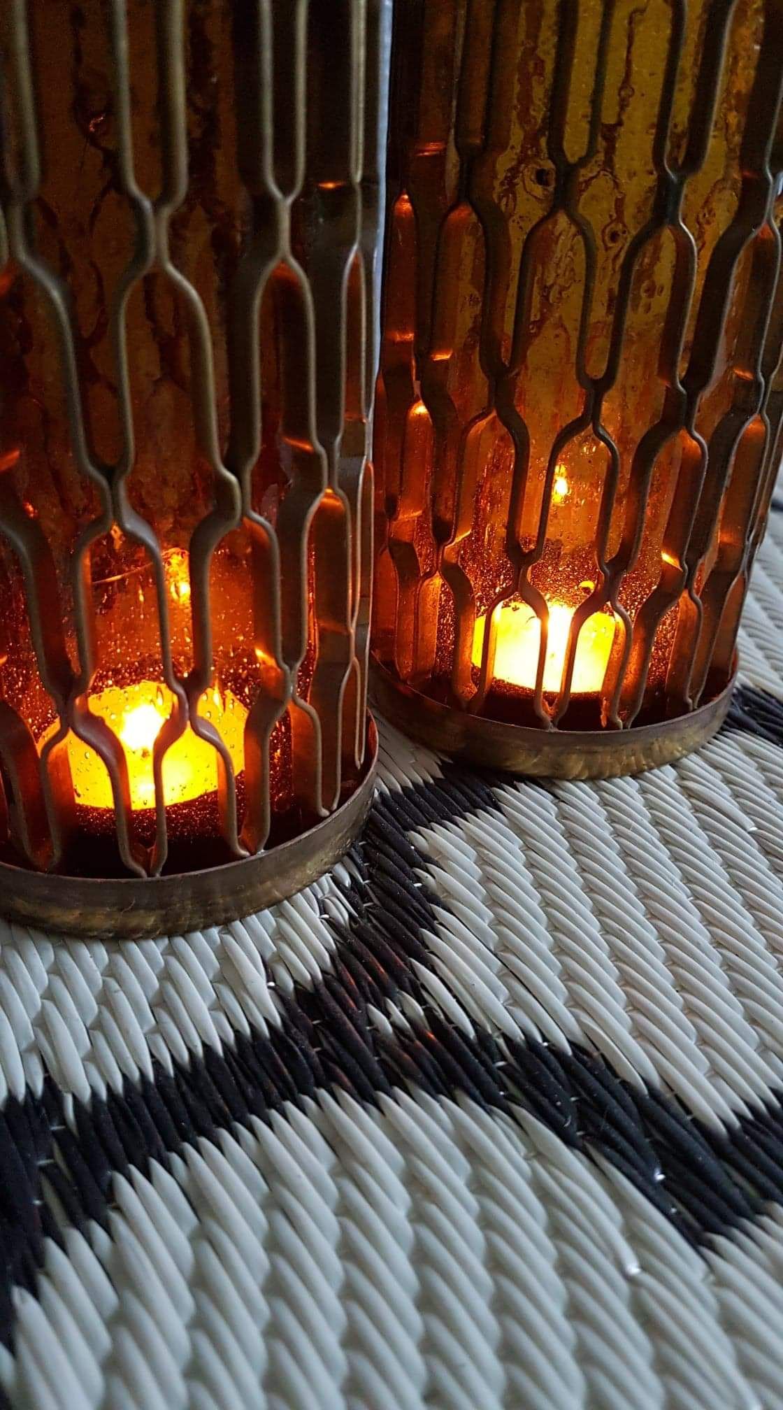Photophores moucharabieh style candlesticks in brass and orange bubbled glass