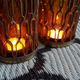 Photophores moucharabieh style candlesticks in brass and orange bubbled glass