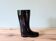 Vintage ceramic vase in the shape of a boot.