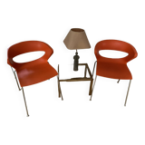 Two orange kicca chairs made in italy tbe
