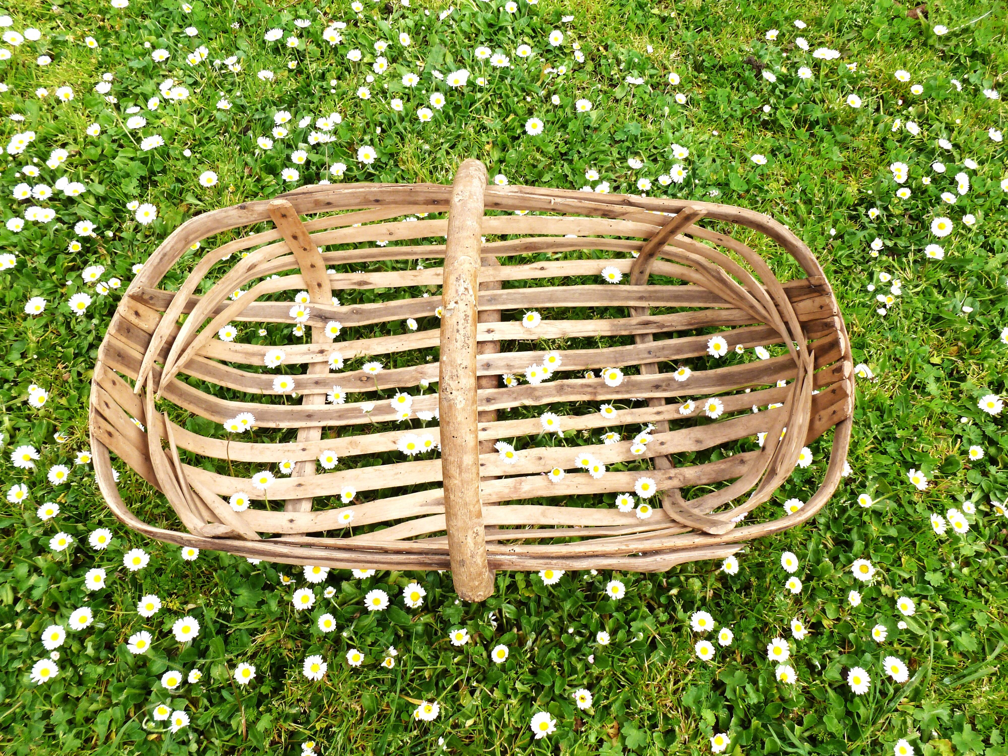 Old wooden harvest basket, slatted wooden basket, folk art.