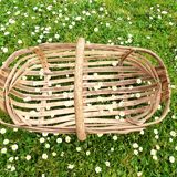 Old wooden harvest basket, slatted wooden basket, folk art.
