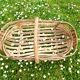 Old wooden harvest basket, slatted wooden basket, folk art.