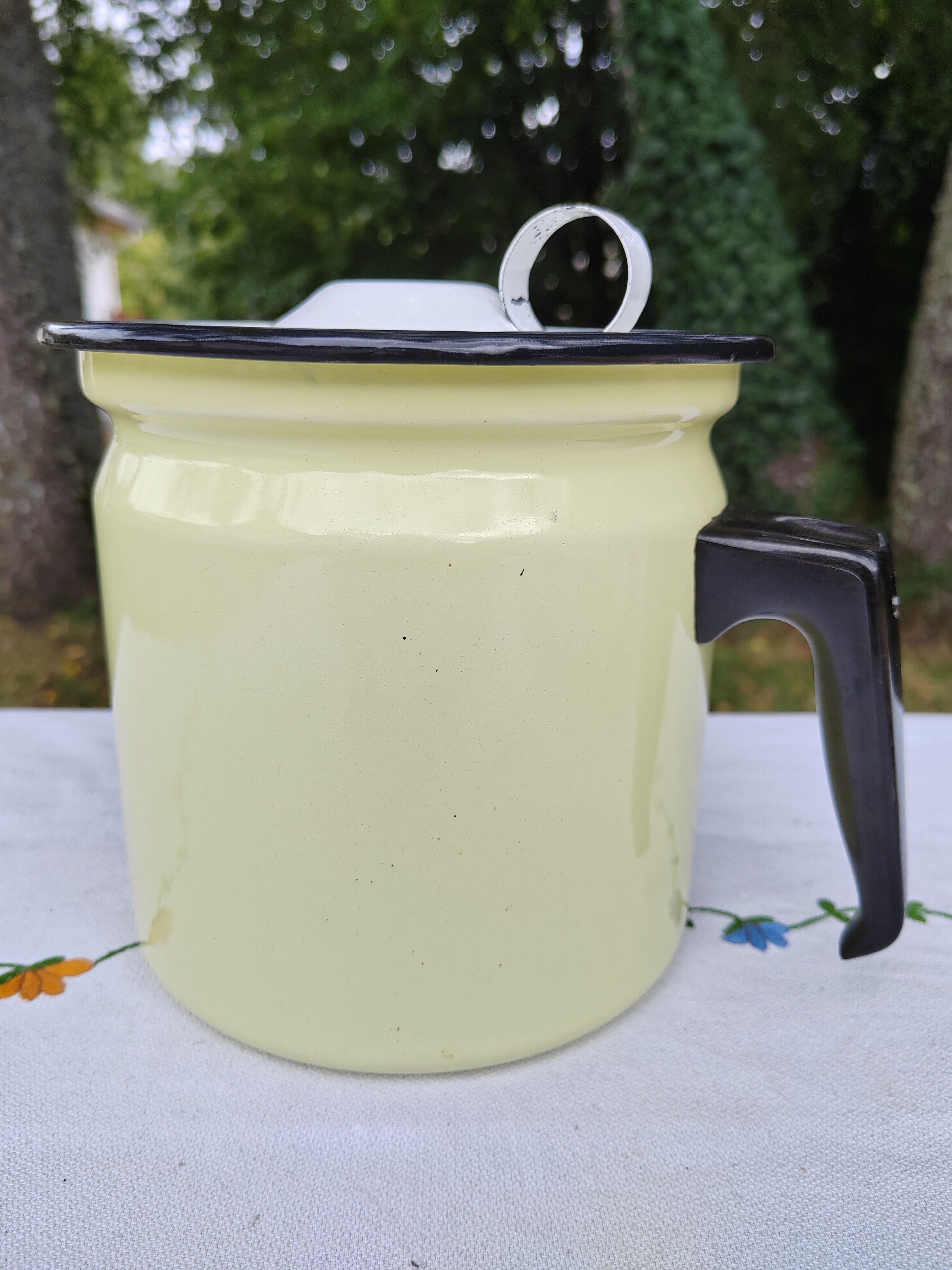 Yellow enamelled milk kettle