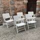 Five wooden garden armchairs