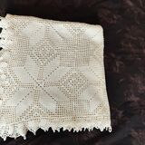 White cotton bedspread, crocheted sofa throw with star patterns