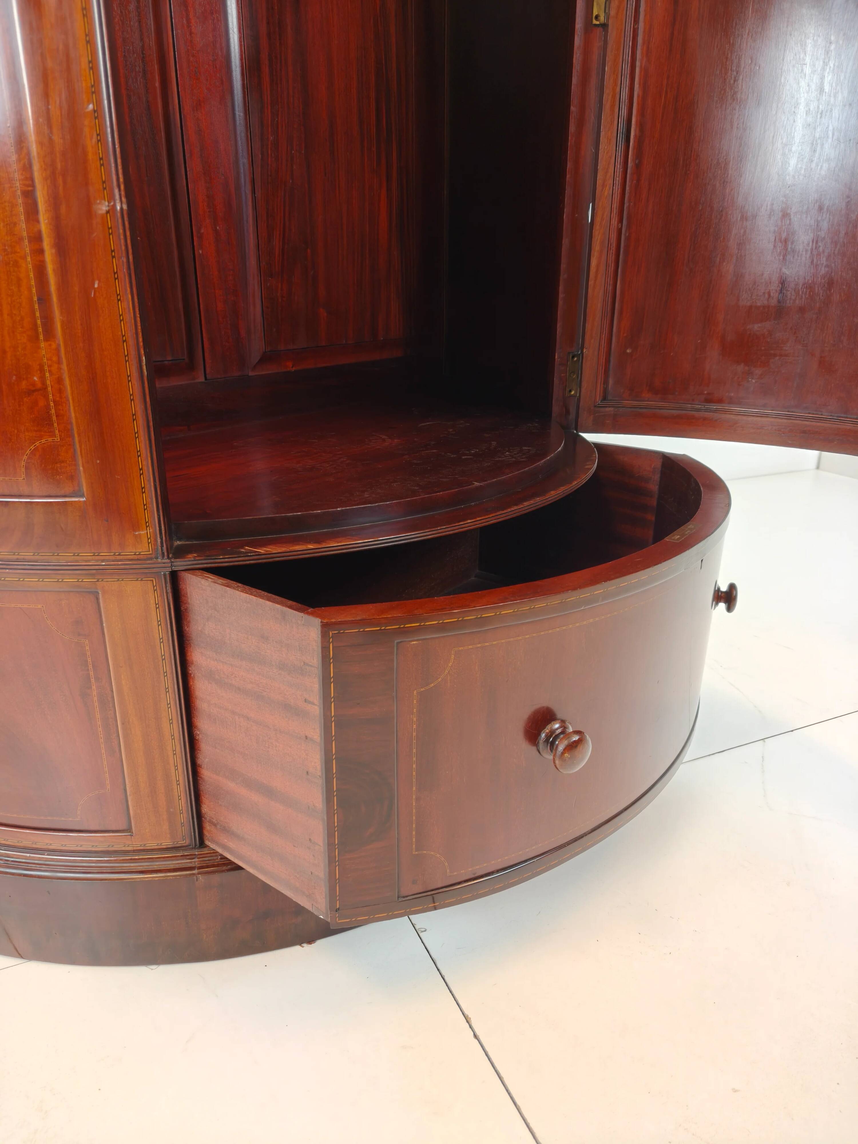 Edwardian mahogany bow-fronted wardrobe by Maple & Co