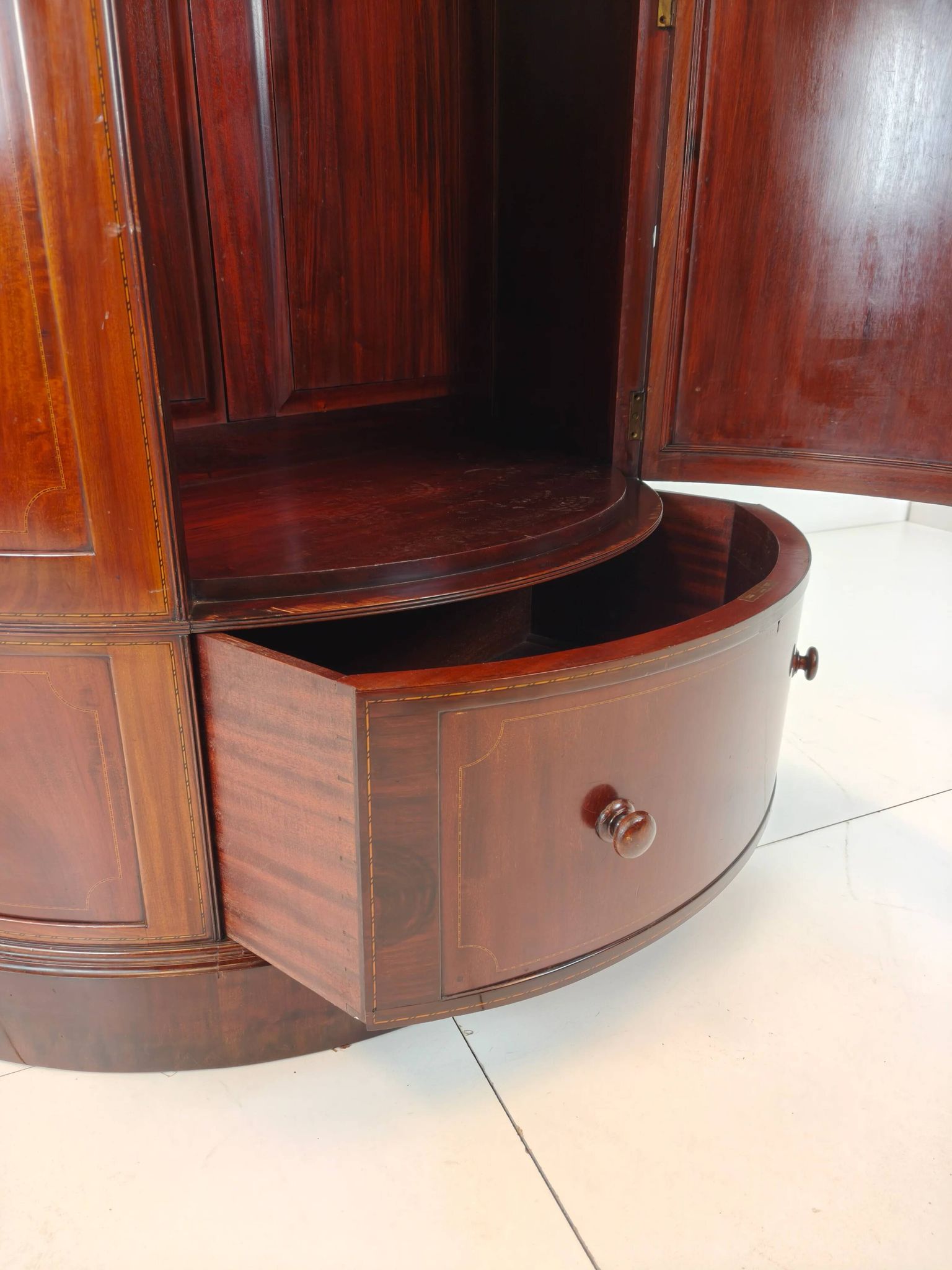 Edwardian mahogany bow-fronted wardrobe by Maple & Co